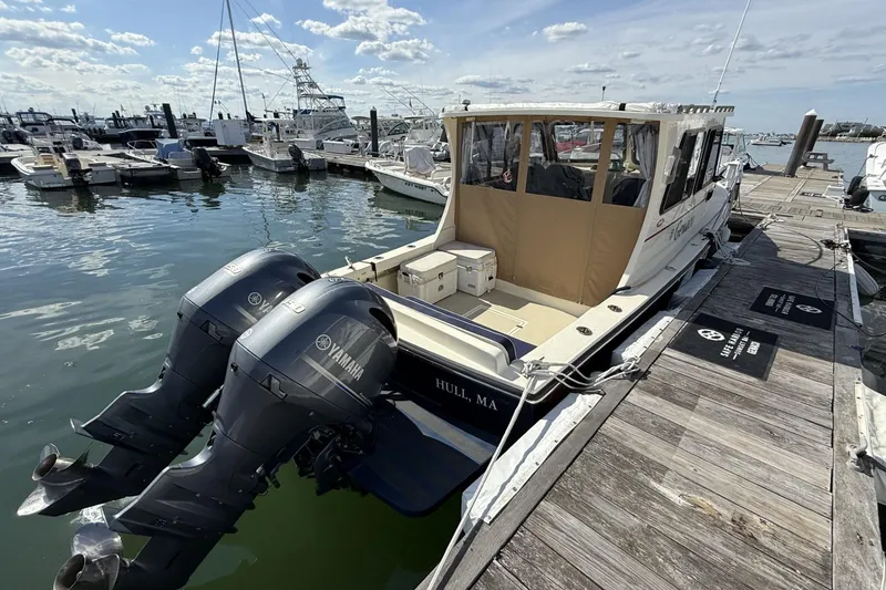 Slide: The Image of 2020 Eastern Islander 270 boat docked with twin Yamaha outboard engines. - 3