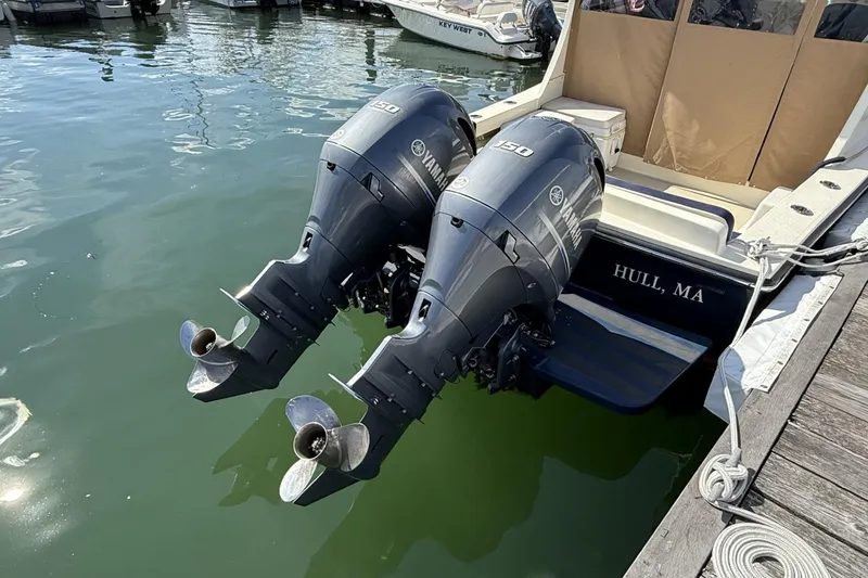 Slide: The Image of Twin Yamaha outboard motors on a 2020 Eastern Islander 270 boat docked in Hull, MA. - 5