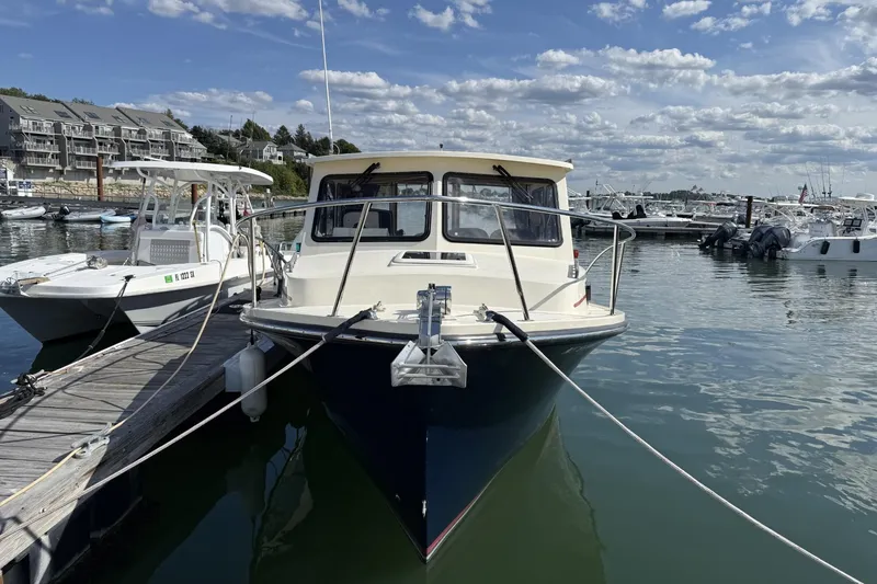 Slide: The Image of 2020 Eastern Islander 270 boat docked at marina under a partly cloudy sky. - 6
