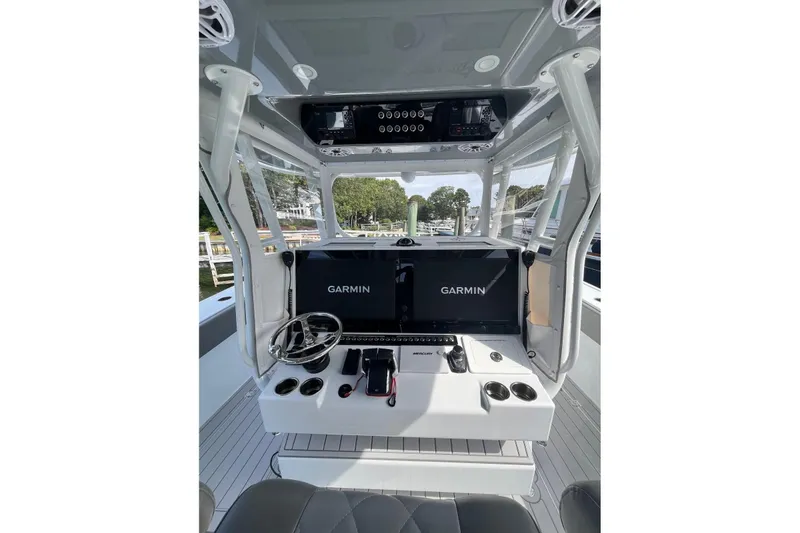 Slide: The Image of Freeman 42 LR 2025 boat cockpit with Garmin navigation displays and modern controls. - 22