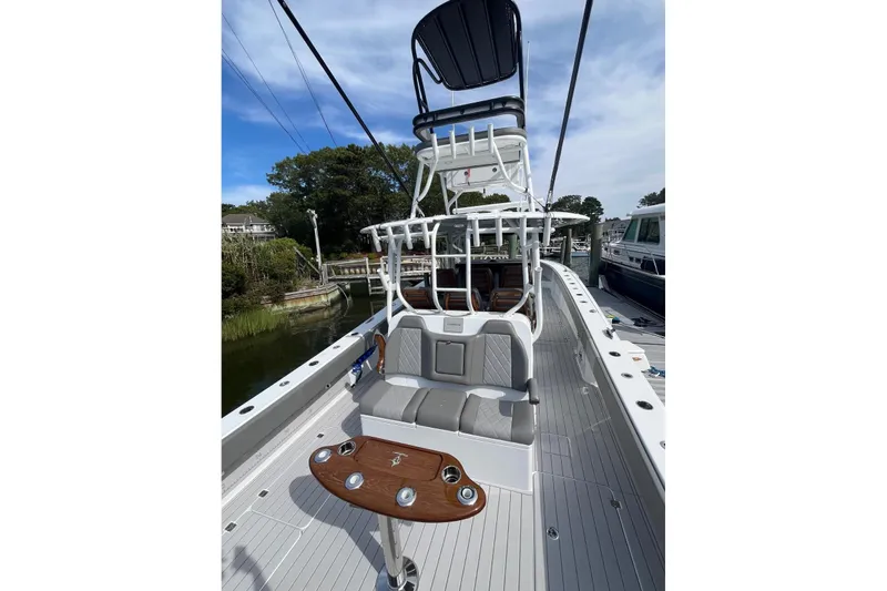 Slide: The Image of 2025 Freeman 42 LR boat with elevated seating and sleek deck design. - 26