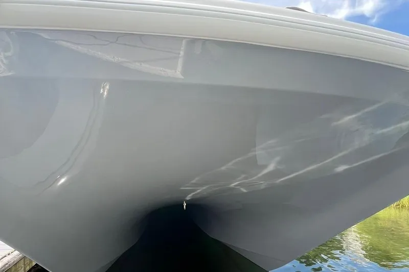 Slide: The Image of Close-up of 2025 Freeman 42 LR boat hull reflecting water and sky. - 29