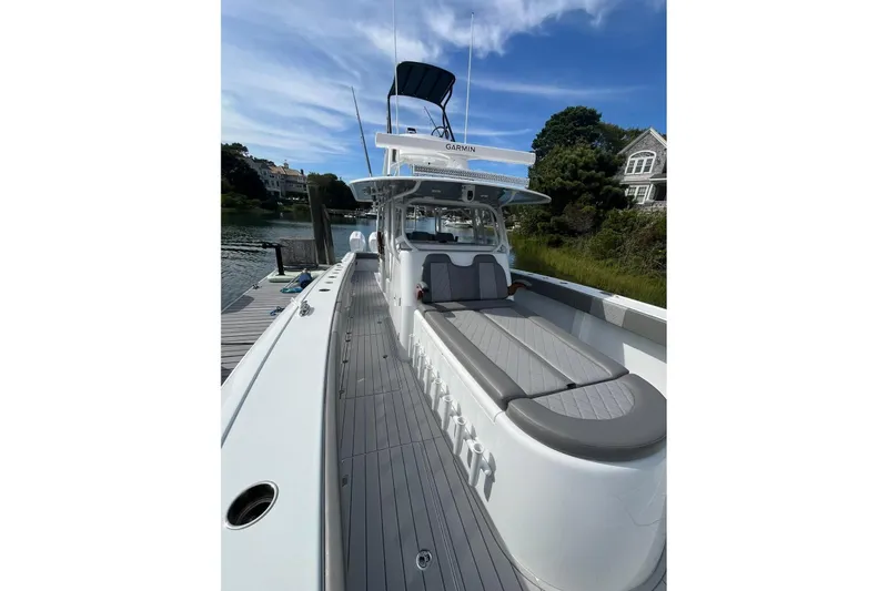 Slide: The Image of 2025 Freeman 42 LR boat docked, featuring sleek design and spacious deck. - 41