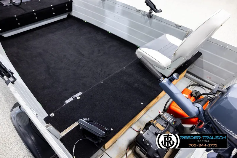 Slide: The Image of Interior of a 1993 Sylvan 14 VFO boat with seating and motor controls. - 10