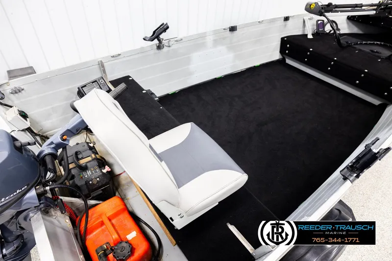 Slide: The Image of Interior of a 1993 Sylvan 14 VFO boat with seating and equipment. - 11