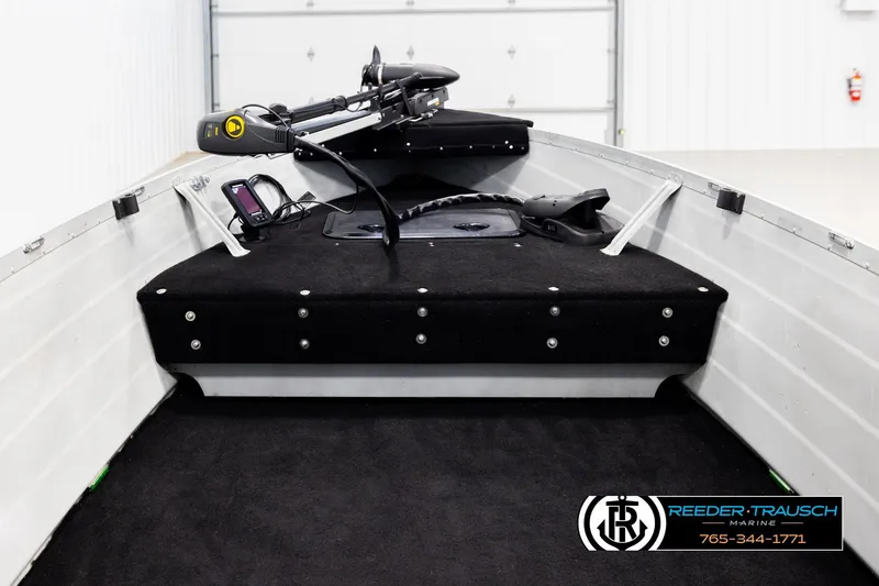 Slide: The Image of 1993 Sylvan 14 VFO boat interior with trolling motor and control panel. - 13