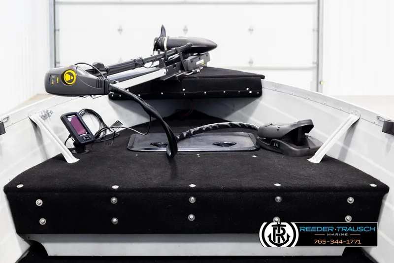 Slide: The Image of 1993 Sylvan 14 VFO boat interior with trolling motor and fish finder. - 14