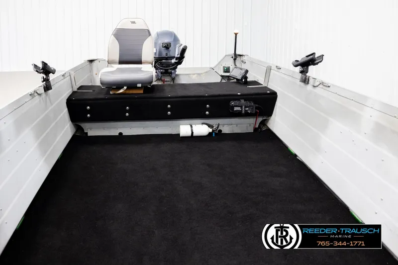 Slide: The Image of 1993 Sylvan 14 VFO boat interior with seating and equipment, displayed by Reeder-Trausch Marine. - 16