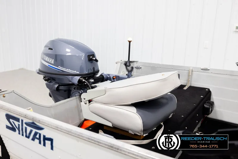Slide: The Image of 1993 Sylvan 14 VFO boat with Yamaha outboard motor in a showroom setting. - 18