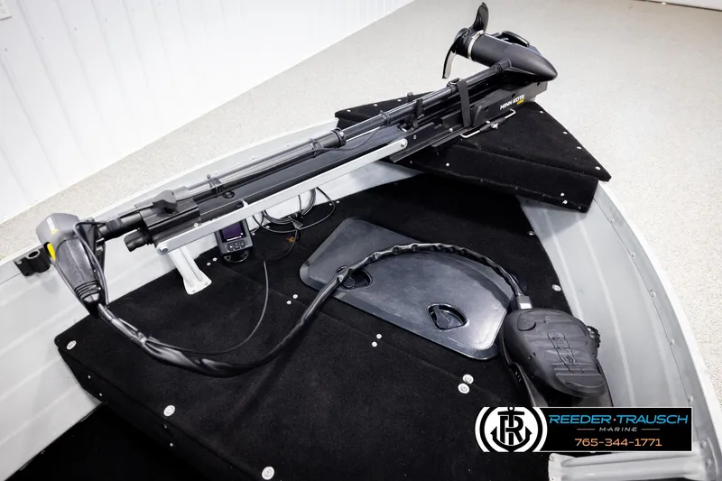 Slide: The Image of 1993 Sylvan 14 VFO boat interior with trolling motor and control panel. - 26