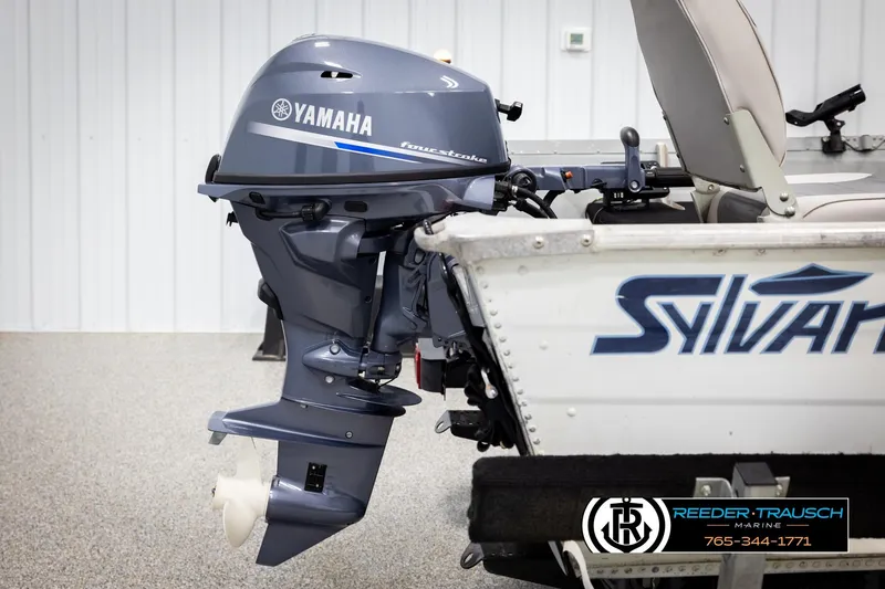 Slide: The Image of 1993 Sylvan 14 VFO boat with Yamaha outboard motor in a showroom. - 30