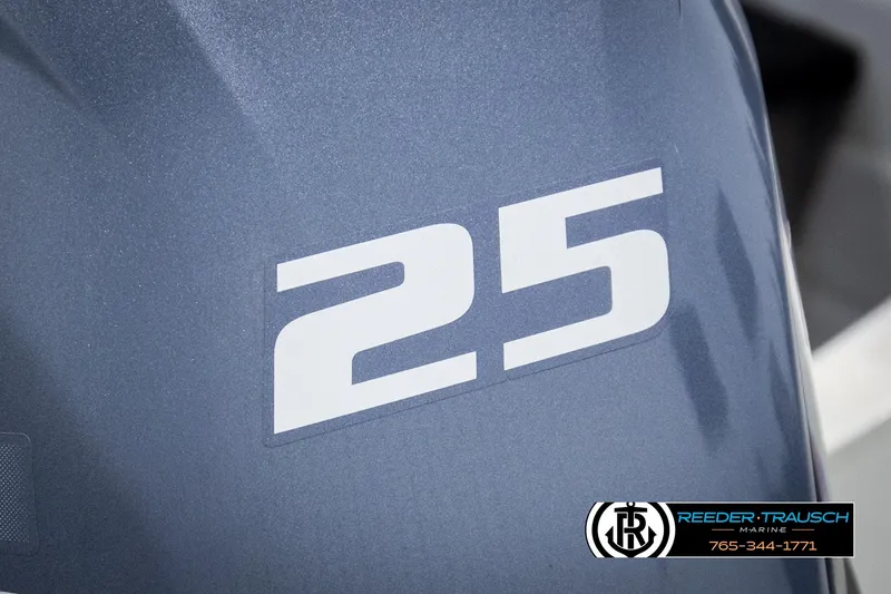 Slide: The Image of Close-up of Sylvan 14 VFO 1993 boat engine with '25' decal, Reeder-Trausch Marine logo. - 32
