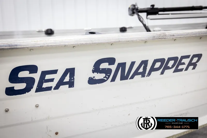 Slide: The Image of 1993 Sylvan 14 VFO boat with "Sea Snapper" text on the side, Reeder-Trausch Marine logo. - 36
