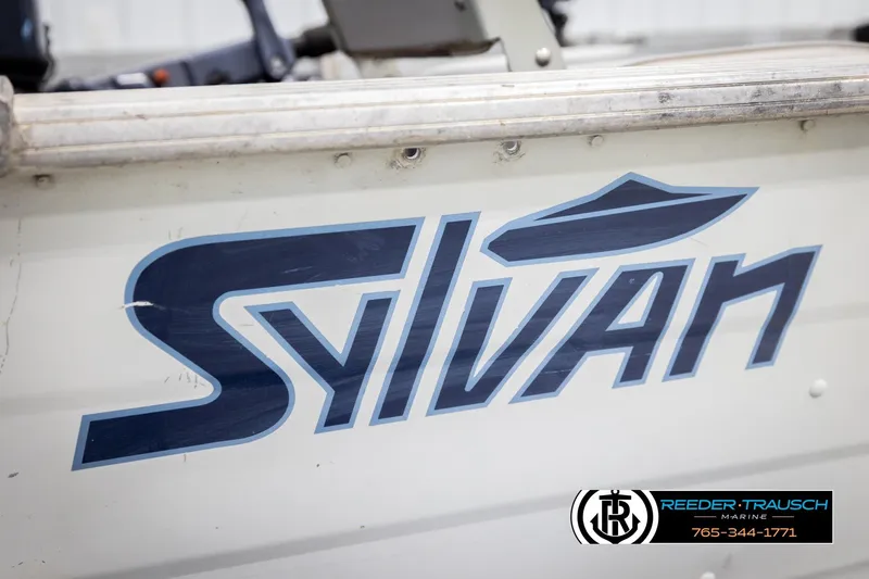 Slide: The Image of 1993 Sylvan 14 VFO boat with logo and Reeder-Trausch Marine contact details. - 37