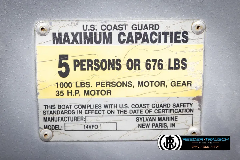 Slide: The Image of 1993 Sylvan 14 VFO capacity plate, 5 persons or 676 lbs, U.S. Coast Guard compliant. - 38