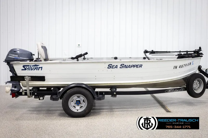 Slide: The Image of 1993 Sylvan 14 VFO boat on trailer with Yamaha motor, labeled "Sea Snapper." - 4
