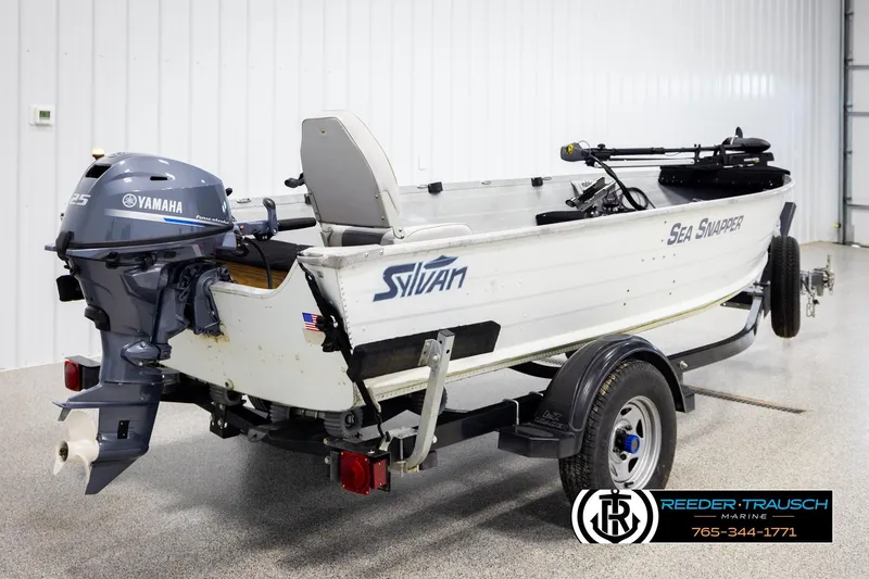 Slide: The Image of 1993 Sylvan 14 VFO boat with Yamaha outboard motor on trailer in showroom. - 5
