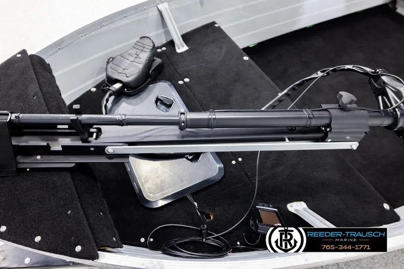 Slide: The Image of 1993 Sylvan 14 VFO boat interior with trolling motor and control panel. - 9