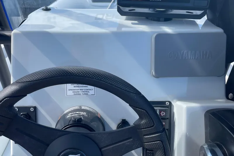 Slide: The Image of Steering console of 2025 Zodiac Pro 5.5 boat with Yamaha controls. - 9
