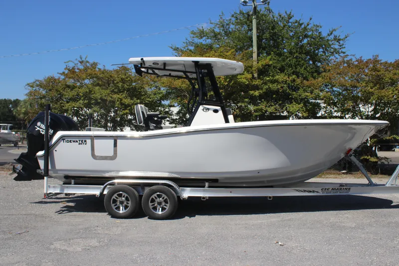 The Image of 2026 Tidewater 256 CC Adventure boat on trailer, side view, outdoors. - 0