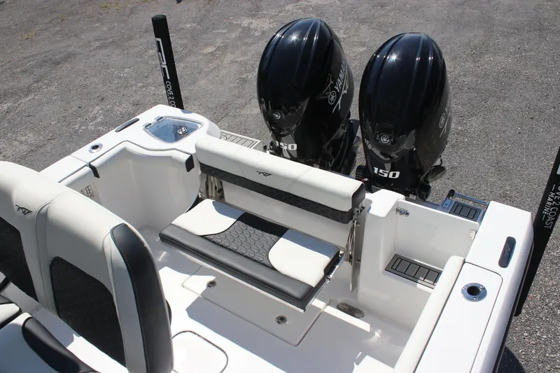 Slide: The Image of 2026 Tidewater 256 CC Adventure boat with dual Yamaha 150 engines, rear seating view. - 11