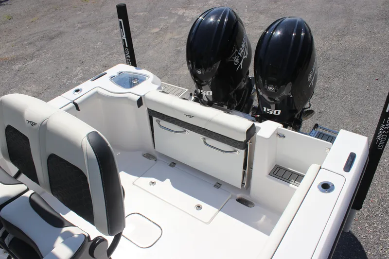 Slide: The Image of 2026 Tidewater 256 CC Adventure boat with dual Yamaha 150 engines, featuring sleek seating. - 13