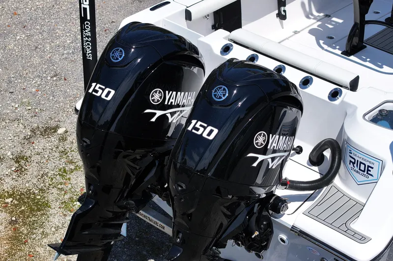 Slide: The Image of Twin Yamaha 150 engines on a 2026 Tidewater 256 CC Adventure boat. - 23