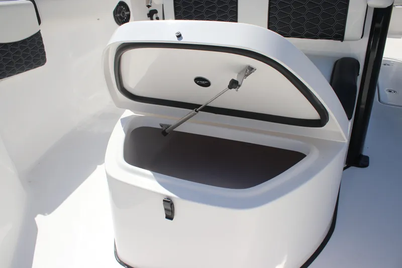 Slide: The Image of Open storage compartment on 2026 Tidewater 256 CC Adventure boat. - 7