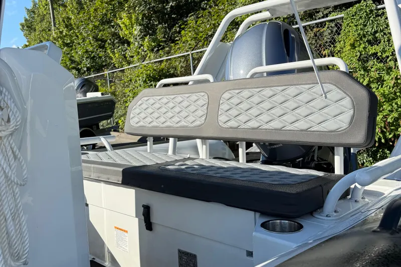 Slide: The Image of 2024 Highfield Sport 560 boat with cushioned seating and modern design. - 15