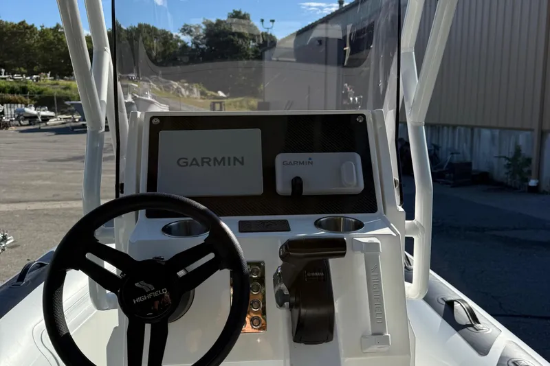 Slide: The Image of 2024 Highfield Sport 560 boat dashboard with Garmin navigation system. - 16
