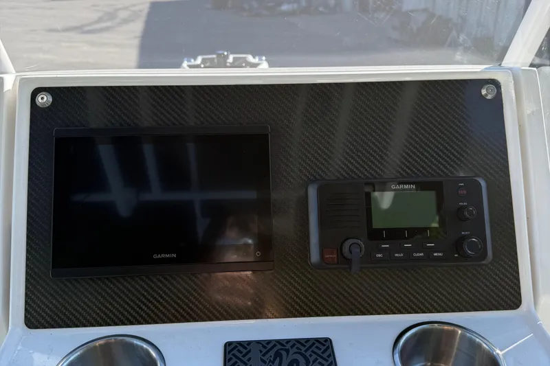 Slide: The Image of Dashboard of 2024 Highfield Sport 560 with Garmin navigation and communication systems. - 19