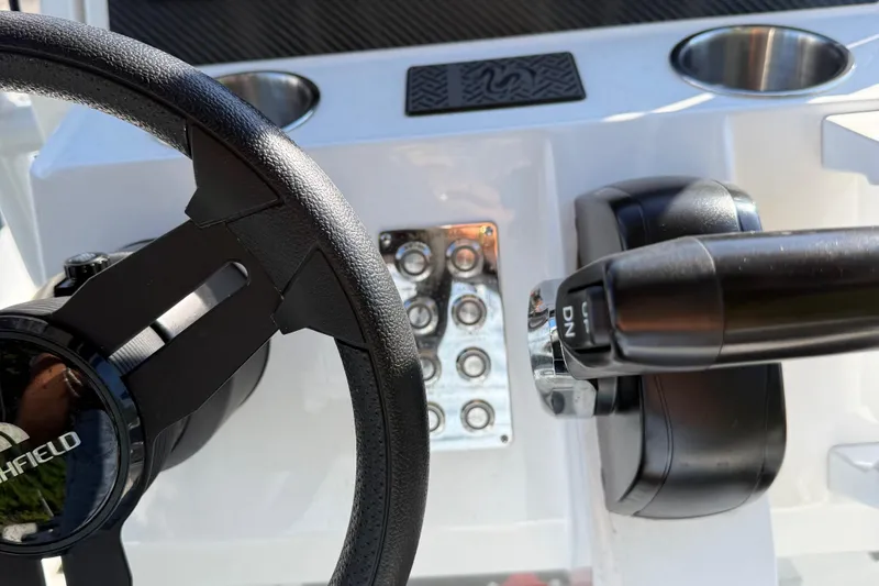 Slide: The Image of 2024 Highfield Sport 560 steering wheel and control panel close-up. - 21