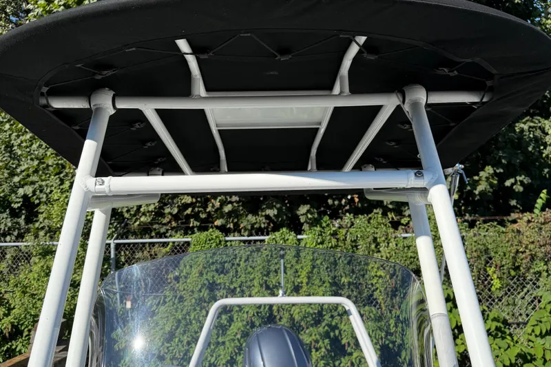 Slide: The Image of 2024 Highfield Sport 560 boat canopy and windshield detail. - 26