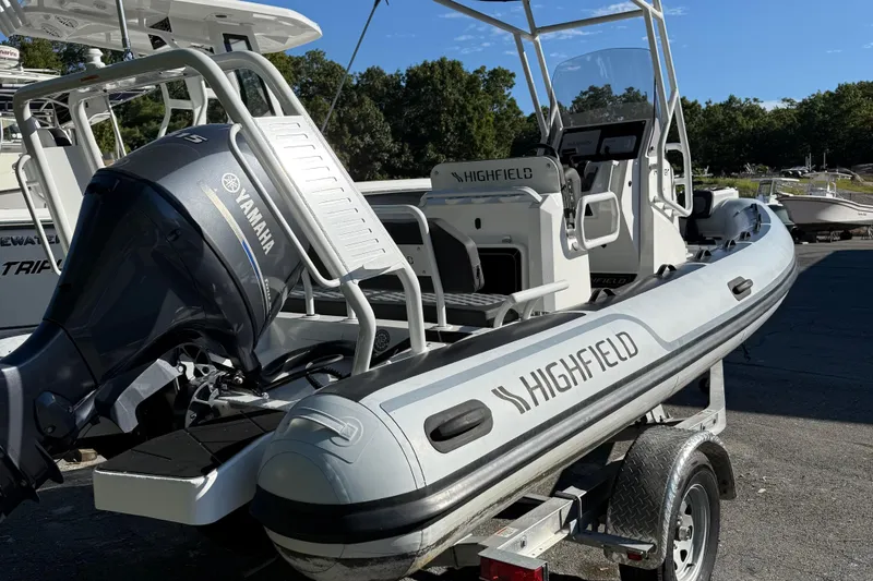 Slide: The Image of 2024 Highfield Sport 560 boat with Yamaha engine on a trailer, outdoors. - 9