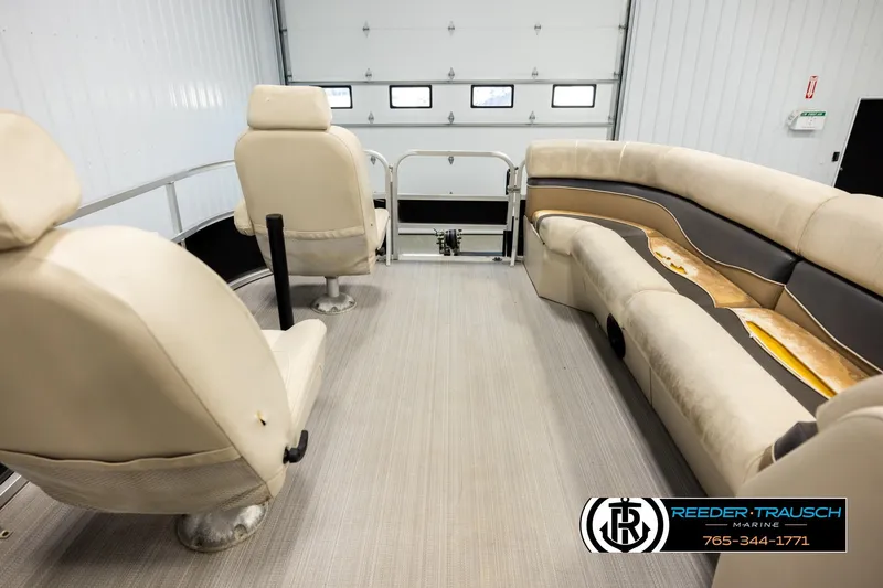 Slide: The Image of 2011 Misty Harbor 2285 CS pontoon boat interior with beige seating and flooring. - 18