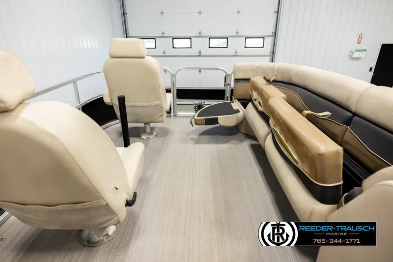 Slide: The Image of 2011 Misty Harbor 2285 CS pontoon boat interior with beige seating and flooring. - 19