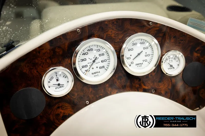 Slide: The Image of Dashboard of 2011 Misty Harbor 2285 CS boat with gauges and wood finish. - 29