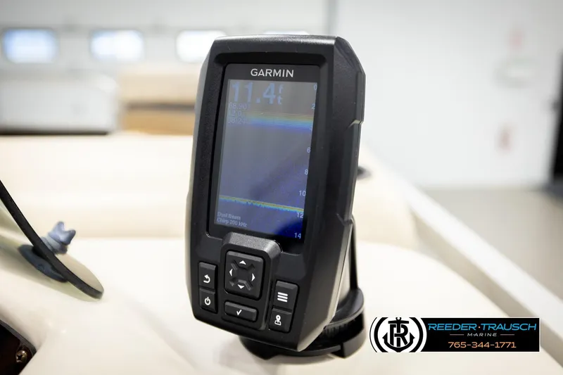 Slide: The Image of Garmin fish finder on 2011 Misty Harbor 2285 CS boat, Reeder-Trausch Marine logo visible. - 30