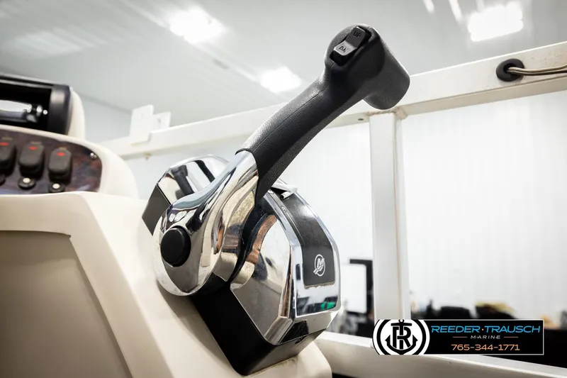 Slide: The Image of Close-up of 2011 Misty Harbor 2285 CS boat throttle control in a marine setting. - 33