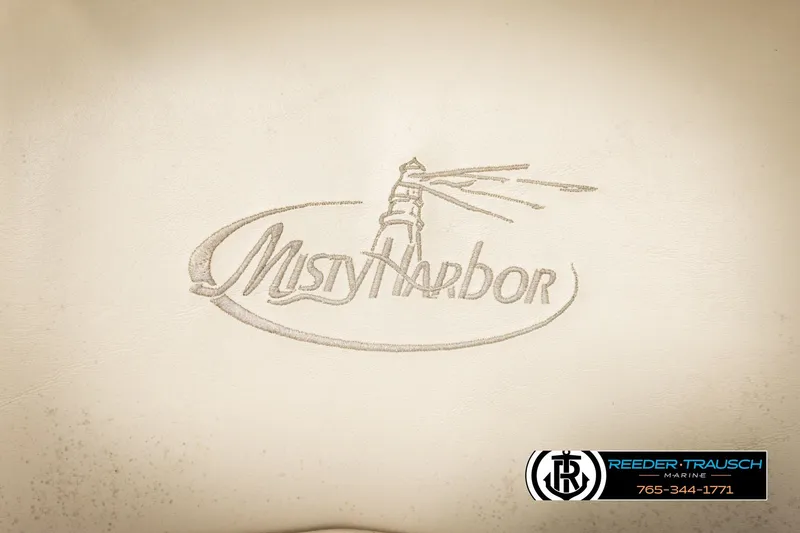 Slide: The Image of 2011 Misty Harbor 2285 CS logo with lighthouse design on beige background. - 35