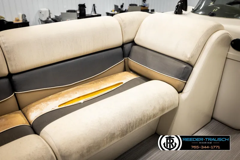Slide: The Image of 2011 Misty Harbor 2285 CS boat interior with beige and gray seating. - 36