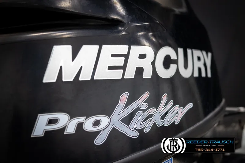 Slide: The Image of Mercury ProKicker outboard motor close-up with Reeder-Trausch Marine logo. - 42