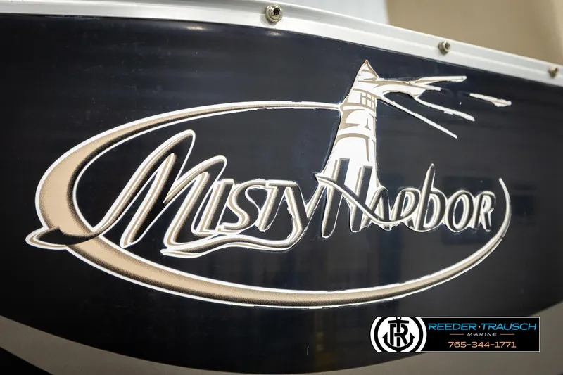 Slide: The Image of 2011 Misty Harbor 2285 CS boat logo with lighthouse design. - 47