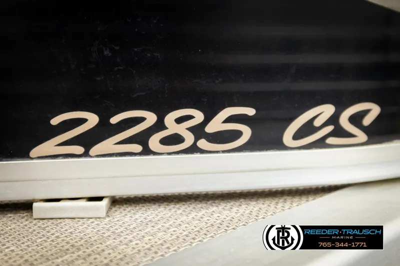 Slide: The Image of 2011 Misty Harbor 2285 CS boat model displayed with Reeder-Trausch Marine logo. - 48