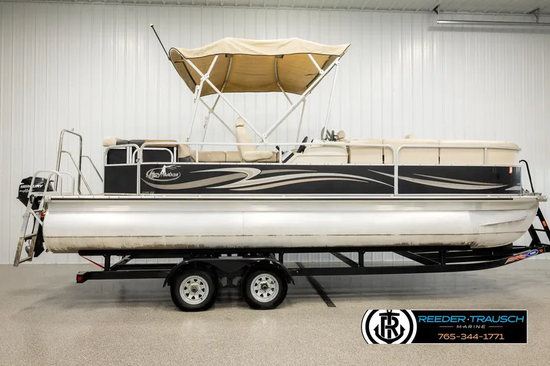 Slide: The Image of 2011 Misty Harbor 2285 CS pontoon boat on trailer in indoor showroom. - 5