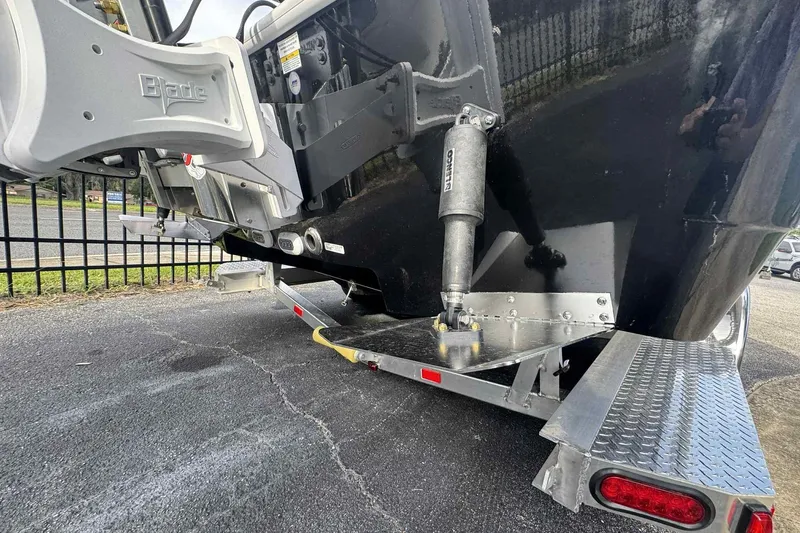 Slide: The Image of 2026 Ranger 2510 Bay boat on trailer, showcasing hull and motor details. - 14