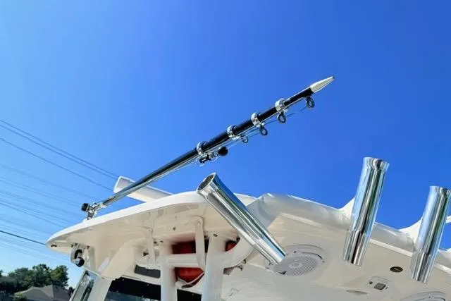 Slide: The Image of 2014 Everglades 325 Center Console boat interior with seating and table. - 11