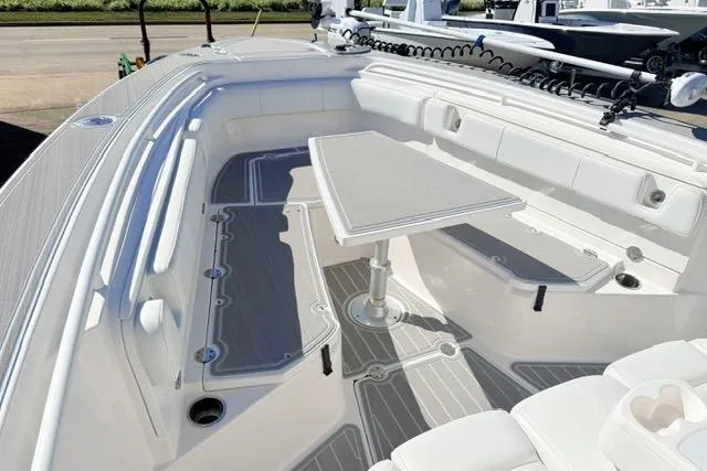 Slide: The Image of 2014 Everglades 325 Center Console boat interior with spacious seating and modern design. - 12