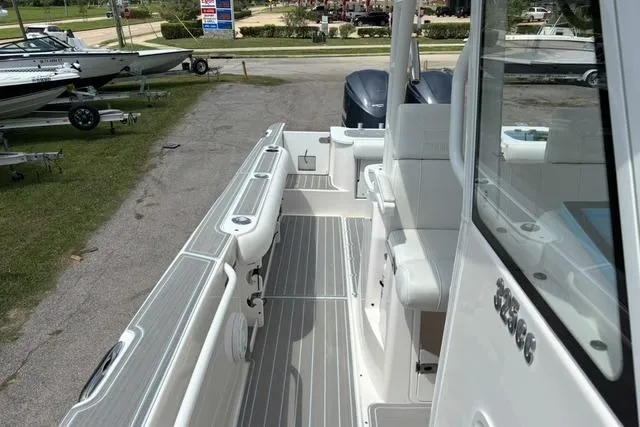 Slide: The Image of 2014 Everglades 325 Center Console boat on trailer with Yamaha outboard motor. - 2
