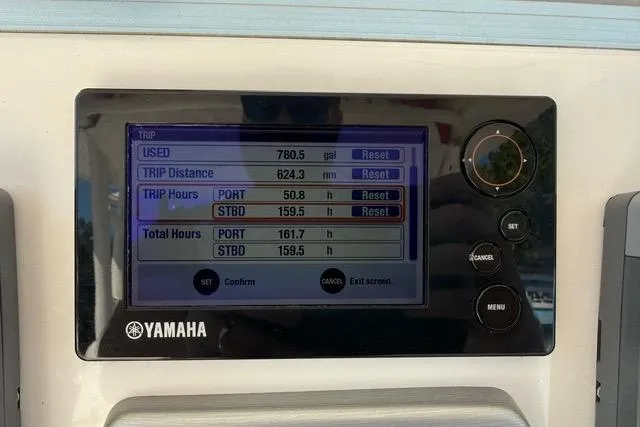 Slide: The Image of Control panel of a 2014 Everglades 325 Center Console boat with dual displays. - 25